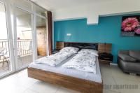 Posteľ alebo postele v izbe v ubytovaní Tisza Gyöngye Apartmanok