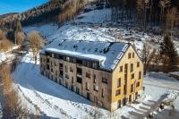 an aerial view of a building in the snow at Mlýn Herlíkovice in Hořejší Vrchlabí