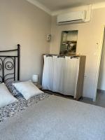 Łóżko lub łóżka w pokoju w obiekcie Villa climatisé avec piscine et jacuzzi