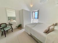 A bed or beds in a room at Pagliarulo Complex by AMALFIVACATION