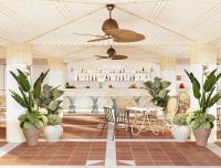 a restaurant with potted plants and a table at Don Carlos Marbella in Marbella