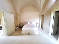 A bed or beds in a room at Casina Fontana Bed & Breakfast
