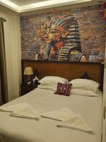 Postel nebo postele na pokoji v ubytování Atlantis Pyramids Inn New