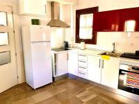 A kitchen or kitchenette at Apartamentos Ilíberis