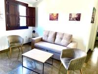 A seating area at Apartamentos Ilíberis