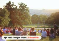 a crowd of people sitting in the grass in a park at Astor Hyde Park Hostel in London