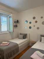 Postel nebo postele na pokoji v ubytování Apartman B&B