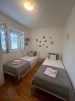 Postel nebo postele na pokoji v ubytování Apartman B&B