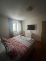 Postel nebo postele na pokoji v ubytování Apartman B&B