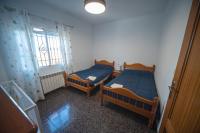 Postel nebo postele na pokoji v ubytování Casa rural Granada Los Corralillos de Pepa