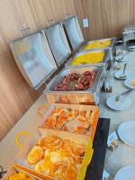 a buffet of different types of food on a table at Fabuloso Hotel Alvorada - Apt da Rede Premium in Brasilia