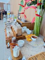 a buffet line with bowls and other food items at Fabuloso Hotel Alvorada - Apt da Rede Premium in Brasilia