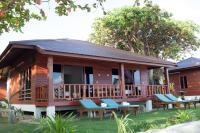 a cabin with picnic tables and chairs in front of it at PingChan Koh Phangan Beachfront Resort in Thong Nai Pan Yai