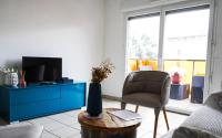 Televízia a/alebo spoločenská miestnosť v ubytovaní Bel appartement climatisé & parking