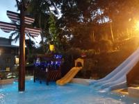 a slide at a water park at night at Cocos Hot Spring Hotel in Ruisui