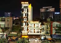 a tall building with a sign on top of it at Chill House in Quy Nhon