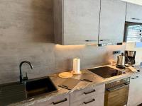 A kitchen or kitchenette at Alpenapart Singer - contactless check-in