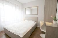 Posteľ alebo postele v izbe v ubytovaní Apartment Masarska