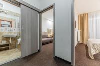 A bed or beds in a room at Hotel Hrabovo