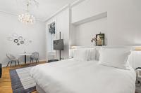 Postel nebo postele na pokoji v ubytování Vodickova Luxury Suites