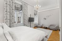 Postel nebo postele na pokoji v ubytování Vodickova Luxury Suites
