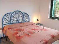 A bed or beds in a room at Borgo Le Logge