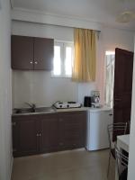Kuchyň nebo kuchyňský kout v ubytování Fantasia Hotel Apartments