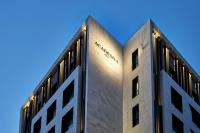 a building with a amazon sign on the side of it at Academias Hotel, Autograph Collection in Athens