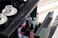 an open refrigerator filled with lots of soda bottles at Academias Hotel, Autograph Collection in Athens