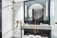 a bathroom with a sink and a shower at Academias Hotel, Autograph Collection in Athens
