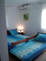 Posteľ alebo postele v izbe v ubytovaní Apartments Antonija