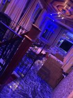 een uitzicht op een bar met paarse lichten bij Luxury Terrace Guest House in Bonamakolo