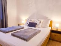 Łóżko lub łóżka w pokoju w obiekcie Apartment Dunato I