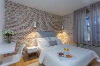 Posteľ alebo postele v izbe v ubytovaní Bifora Heritage Hotel