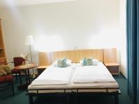 Postel nebo postele na pokoji v ubytování Penzion Hotelu Central