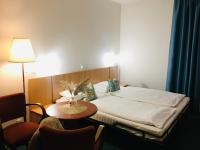 Postel nebo postele na pokoji v ubytování Penzion Hotelu Central