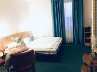 Postel nebo postele na pokoji v ubytování Penzion Hotelu Central