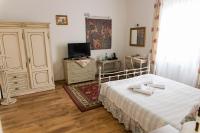 Posteľ alebo postele v izbe v ubytovaní Hotel Napoleon