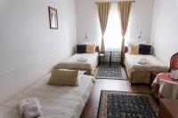 Posteľ alebo postele v izbe v ubytovaní Hotel Napoleon