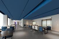 a dining room with tables and chairs and blue ceilings at Atour Light Hotel Shanghai Pudong Chuansha Road in Shanghai