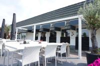 En restaurant eller et andet spisested på Kustverhuur, Park Schoneveld, Stern 240