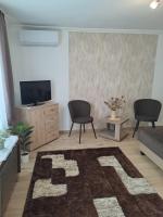 Telewizja i/lub zestaw kina domowego w obiekcie Katarina apartman