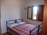 A bed or beds in a room at Borgo Le Logge