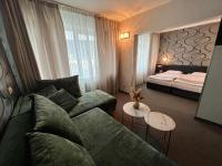 A bed or beds in a room at Hotel Rila