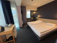 A bed or beds in a room at Hotel Rila