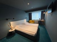 A bed or beds in a room at Hotel Rila