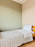 Posteľ alebo postele v izbe v ubytovaní Sun City View Thessaloniki