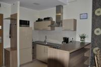Kuchyňa alebo kuchynka v ubytovaní Olympic Park Apartment