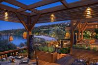 a restaurant with a view of the water at Mandarin Oriental, Bodrum in Golturkbuku