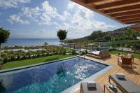 a swimming pool with a view of the ocean at Mandarin Oriental, Bodrum in Golturkbuku